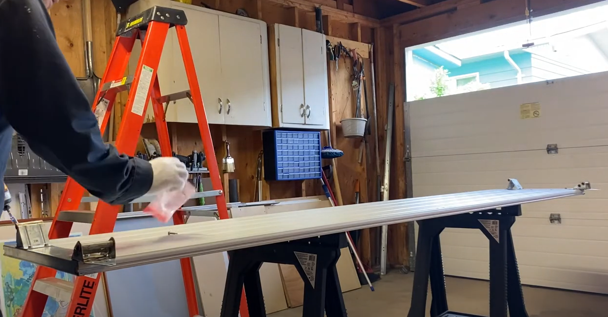 Professional technician expertly repairing a garage door panel, demonstrating high-quality service by Alum Creek Garage Doors Repair.