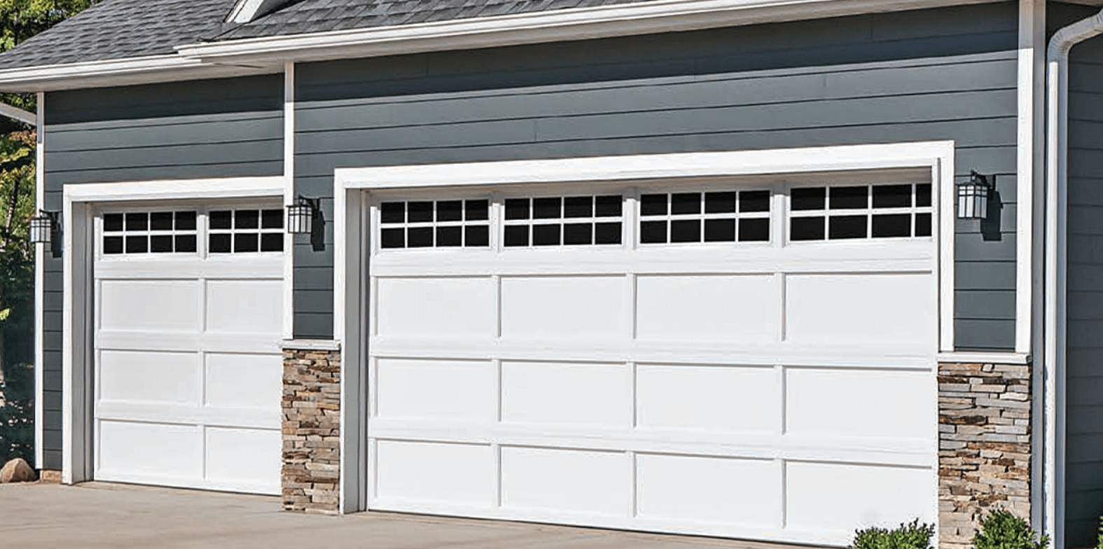 Professional garage door installation service by Alum Creek Garage Doors Repair, featuring a modern white garage door being securely fitted to a residential home.