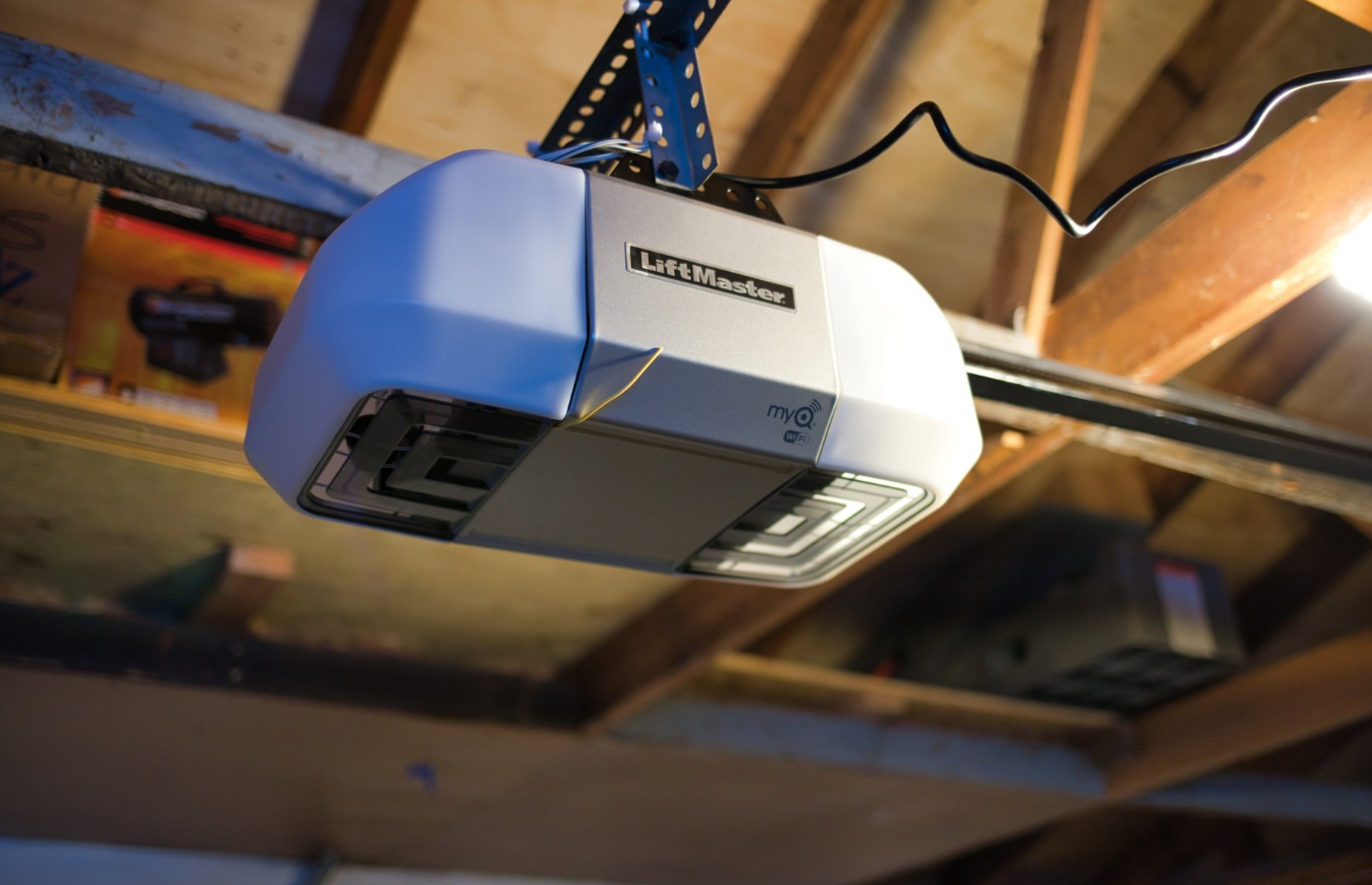 a modern garage with an Alum Creek Garage Doors Repair technician installing a state-of-the-art garage door opener. The garage features a sleek, automated system with advanced security features. Ideal for homeowners seeking reliable garage door solutions in Alum Creek.